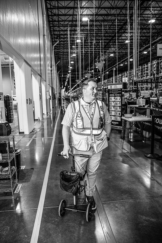 LONG TREK: Lee begins his walkabout (or is it a wheelabout?) in the 1.3 million-square-foot Amazon fulfillment center in Republic.